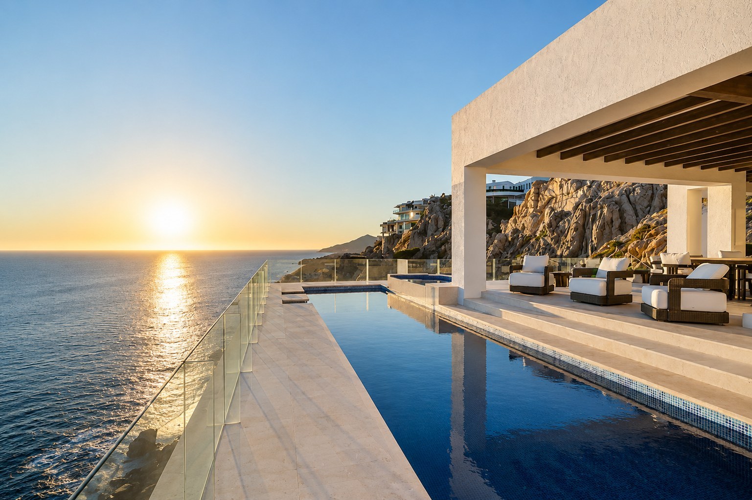 Pedregal villa infinity pool at sunset overlooking the ocean — pool cleaning and remodel